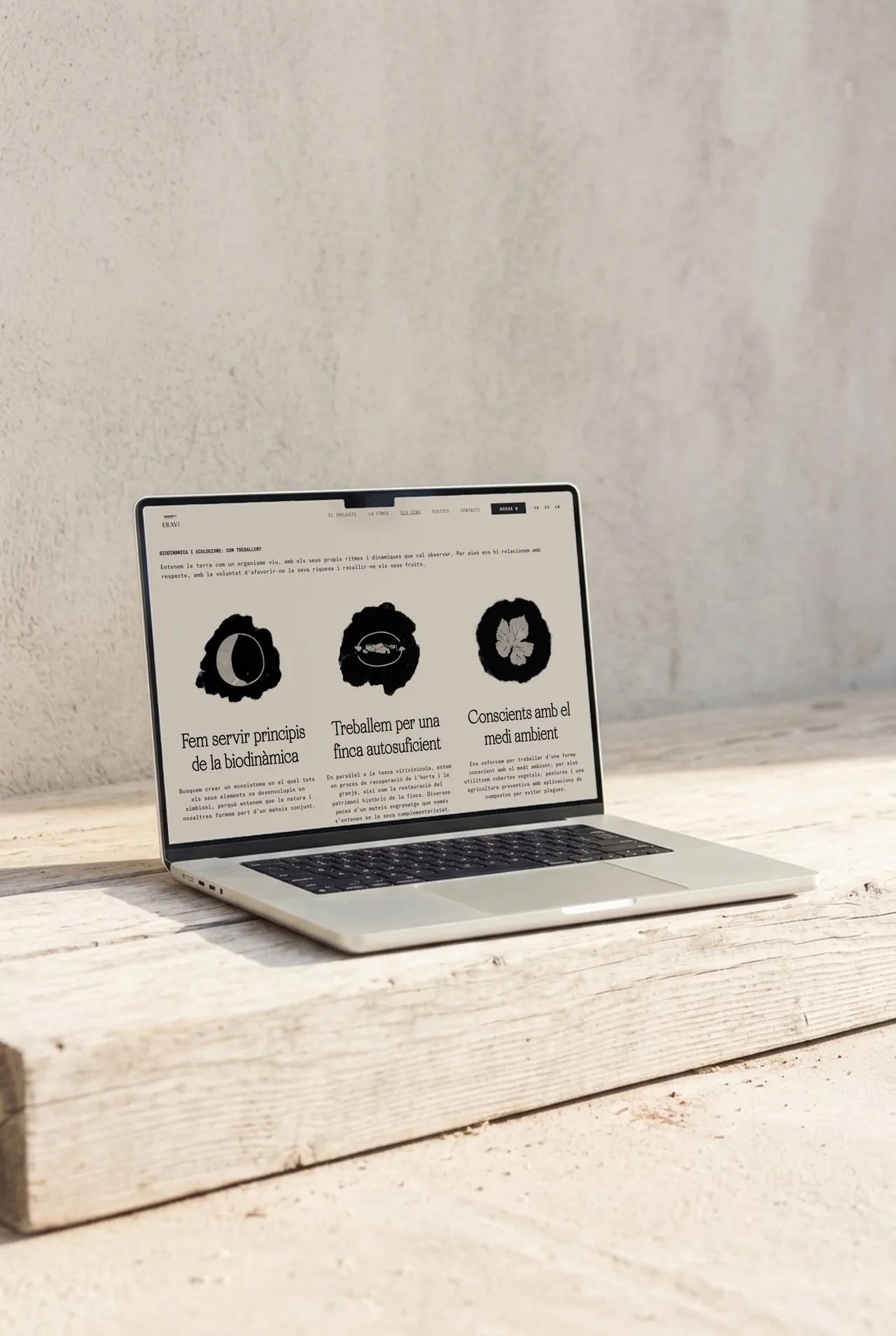 ERAVi winery website on a laptop: biodynamics and ecology section with three icons and three working principles