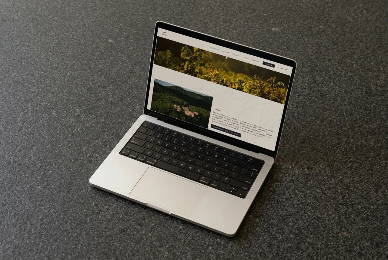 ERAVi winery website on a laptop: estate section with the vineyard, the farmhouse among the woods and a contour-line map